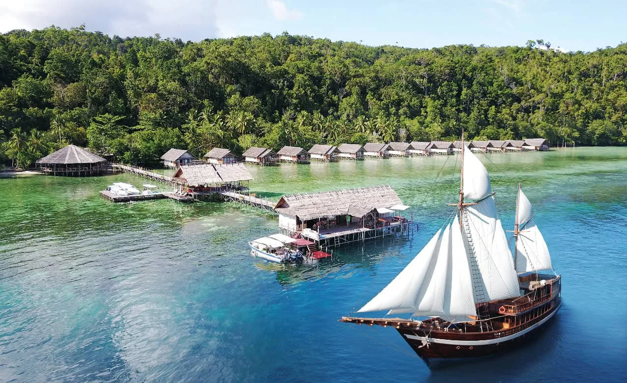 Coralia Liveaboard in front of Papua Explorers Dive Resort